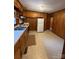 Kitchen features wood cabinets and tiled floor at 112 Adcock St, Belmont, NC 28012