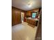 Retro kitchen with wood cabinets and tiled floor at 112 Adcock St, Belmont, NC 28012