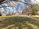 Large backyard featuring a gazebo, shed and fenced-in yard at 1805 Tufnell Ct, Charlotte, NC 28262