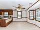 Dining area featuring wood floors, paneled walls and trim, and updated light fixture at 1805 Tufnell Ct, Charlotte, NC 28262