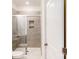 Bathroom featuring a shower with glass enclosure and neutral-toned tile at 2078 Van Buren Rd, Sherrills Ford, NC 28673