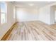 Spacious living room featuring light-colored wood flooring and large windows at 2078 Van Buren Rd, Sherrills Ford, NC 28673