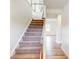 Staircase with carpet runner and wooden handrail leading to the second floor at 2078 Van Buren Rd, Sherrills Ford, NC 28673