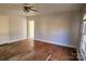 Spacious bedroom with hardwood floors and a ceiling fan at 602 W Graham St, Shelby, NC 28150