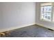 Empty bedroom featuring light walls, hardwood floors, and a window at 602 W Graham St, Shelby, NC 28150