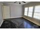 Simple bedroom with dark hardwood floors and multiple windows at 602 W Graham St, Shelby, NC 28150