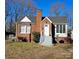 Brick ranch house with a white door, gray steps, and a yard at 602 W Graham St, Shelby, NC 28150