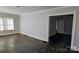 Living room with hardwood floors and access to other rooms at 602 W Graham St, Shelby, NC 28150