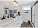 Modern bathroom with double vanity, marble countertops, and a glass-enclosed shower at 625 Charles St, Rockwell, NC 28138