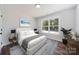 Bright bedroom featuring a large window, hardwood floors, and neutral decor at 625 Charles St, Rockwell, NC 28138