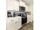 Modern kitchen with stainless steel appliances, subway tile backsplash, and white cabinets at 625 Charles St, Rockwell, NC 28138