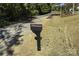 Standard black mailbox on a post next to a newly seeded yard; great for getting mail every day at 625 Charles St, Rockwell, NC 28138