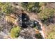 Aerial view of the home's roof line and driveway amidst mature trees at 917 Patrick Johnston Ln, Davidson, NC 28036