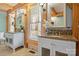 Elegant bathroom featuring double granite vanities, modern fixtures, and natural wood accents at 917 Patrick Johnston Ln, Davidson, NC 28036