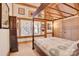 Charming bedroom featuring a wooden four-poster bed and ample natural light at 917 Patrick Johnston Ln, Davidson, NC 28036