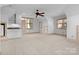 Bedroom features neutral walls, two windows, carpet, and a mini-kitchenette making it perfect for guests at 917 Patrick Johnston Ln, Davidson, NC 28036