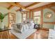 Cozy bedroom with hardwood floors, wooden beams, and a ceiling fan at 917 Patrick Johnston Ln, Davidson, NC 28036