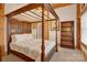 Spacious bedroom with a large four-poster bed and built-in shelving at 917 Patrick Johnston Ln, Davidson, NC 28036