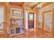 Entryway with hardwood floors, stained glass door and wooden cabinetry at 917 Patrick Johnston Ln, Davidson, NC 28036