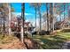 View of charming house exterior, surrounded by lush greenery at 917 Patrick Johnston Ln, Davidson, NC 28036