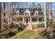 Charming two-story home with inviting front porch, landscaped yard and brick stairs at 917 Patrick Johnston Ln, Davidson, NC 28036