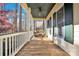 Spacious front porch features ceiling fan and comfy seating at 917 Patrick Johnston Ln, Davidson, NC 28036