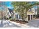 Exterior of charming yellow home with garage at 917 Patrick Johnston Ln, Davidson, NC 28036