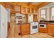 Kitchen with white appliances and custom wood cabinets at 917 Patrick Johnston Ln, Davidson, NC 28036