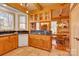 Kitchen features white appliances and ample wood cabinetry at 917 Patrick Johnston Ln, Davidson, NC 28036