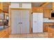 Kitchen features a large refrigerator and custom wood cabinets at 917 Patrick Johnston Ln, Davidson, NC 28036