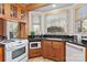 Functional kitchen featuring custom wood cabinetry, granite countertops and a view of the backyard at 917 Patrick Johnston Ln, Davidson, NC 28036