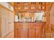 Kitchen boasts custom wood cabinets and granite countertops at 917 Patrick Johnston Ln, Davidson, NC 28036