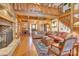 Living room with hardwood floors, exposed beams and stone fireplace at 917 Patrick Johnston Ln, Davidson, NC 28036