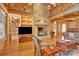 Spacious living room features a large stone fireplace and hardwood floors at 917 Patrick Johnston Ln, Davidson, NC 28036