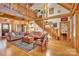 Open living area with high ceilings, exposed beams and stone fireplace at 917 Patrick Johnston Ln, Davidson, NC 28036