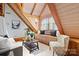 Charming living room featuring vaulted wood beam ceilings, window seat, and bright natural light at 917 Patrick Johnston Ln, Davidson, NC 28036