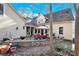 Stone patio with seating area and grill at 917 Patrick Johnston Ln, Davidson, NC 28036