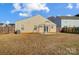 Backyard view showcasing home's back and a patio at 9315 Ames Hollow Rd, Charlotte, NC 28216