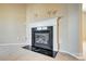 Gas fireplace with white mantel and black hearth at 9315 Ames Hollow Rd, Charlotte, NC 28216