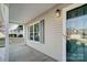 Inviting front porch with gray siding and a glass front door at 9315 Ames Hollow Rd, Charlotte, NC 28216