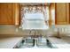 Clean kitchen sink with double basin and new faucet at 9315 Ames Hollow Rd, Charlotte, NC 28216