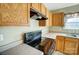 Modern black electric stove and overhead vent at 9315 Ames Hollow Rd, Charlotte, NC 28216