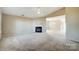 Living room with corner fireplace and vaulted ceiling at 9315 Ames Hollow Rd, Charlotte, NC 28216