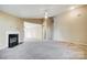 Spacious living room with fireplace and ceiling fan at 9315 Ames Hollow Rd, Charlotte, NC 28216