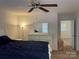 Spacious bedroom with a dresser, large bed, and access to another room at 9514 Currier Rd, Charlotte, NC 28215