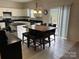 Kitchen with island, white cabinets, and granite counters at 9514 Currier Rd, Charlotte, NC 28215