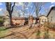 Large backyard with mature trees and patio area at 9638 Pleasant View Ln, Mint Hill, NC 28227