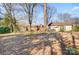 Spacious backyard with mature trees and a large grassy area at 9638 Pleasant View Ln, Mint Hill, NC 28227