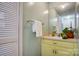 Simple bathroom with light green vanity and white fixtures at 9638 Pleasant View Ln, Mint Hill, NC 28227