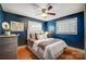 Serene bedroom with a cozy bed and blue walls at 9638 Pleasant View Ln, Mint Hill, NC 28227